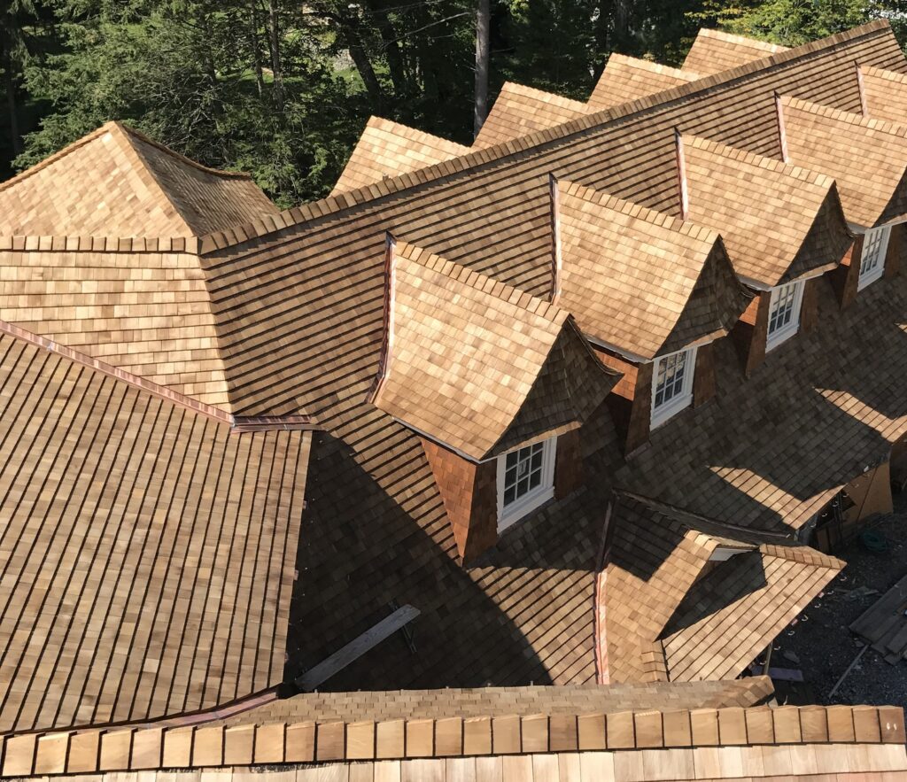 Cedar shake roof aerial multi dormer greater boston ma installed by paul john and son roofing.
