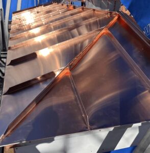 Custom-fabricated copper standing seam bay roof for a Beverly Farms, MA home by Paul John & Son