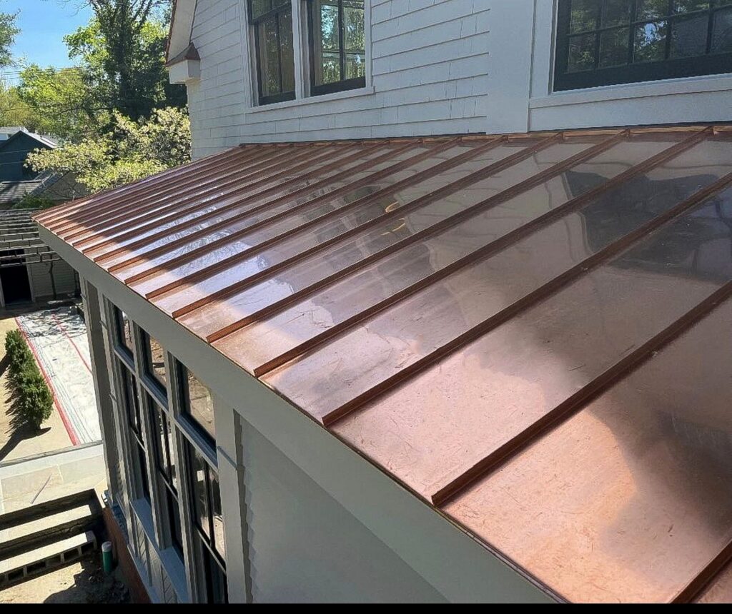 Custom standing seam copper bay roof with new copper finish by Paul John & Son