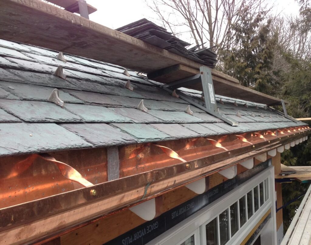 decorative-copper-snow-guards-slate-roof-eave-detail-ma Decorative copper snow guards slate roof eave detail ma