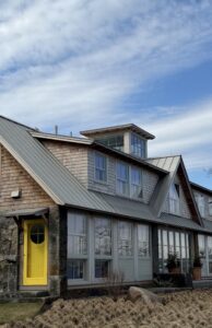 Freedom Gray standing seam copper roof with cedar shake siding and granite foundation on a Massachusetts home by Paul John & Son