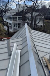 Freedom Gray standing seam copper roof installation in progress on a coastal Massachusetts home by Paul John & Son