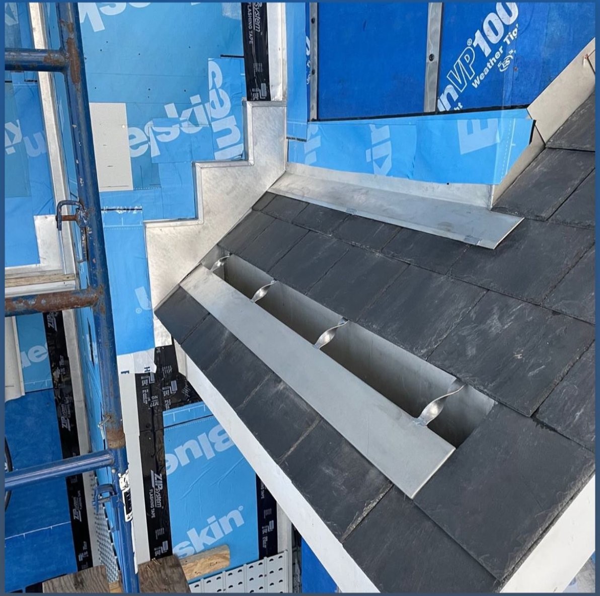 Natural slate roof metal saddle flashing detail ma